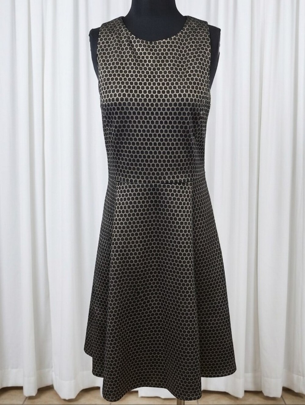 Theory Trekana fit-and-flare compass knit polkadot dress in black.